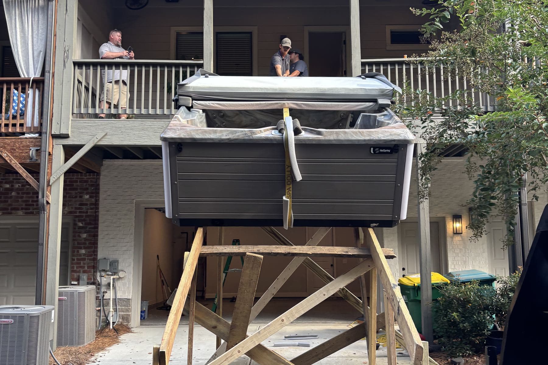 A hot tub raised to second-storey deck height on a timber ramp tower the Platinum crew built on site